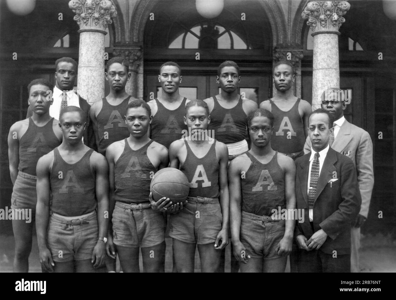 Indianapolis, Indiana:  c. 1928The portrait of the African American basketball team at Crispus Attucks high school and their coach, E.J. Hooper. Stock Photo