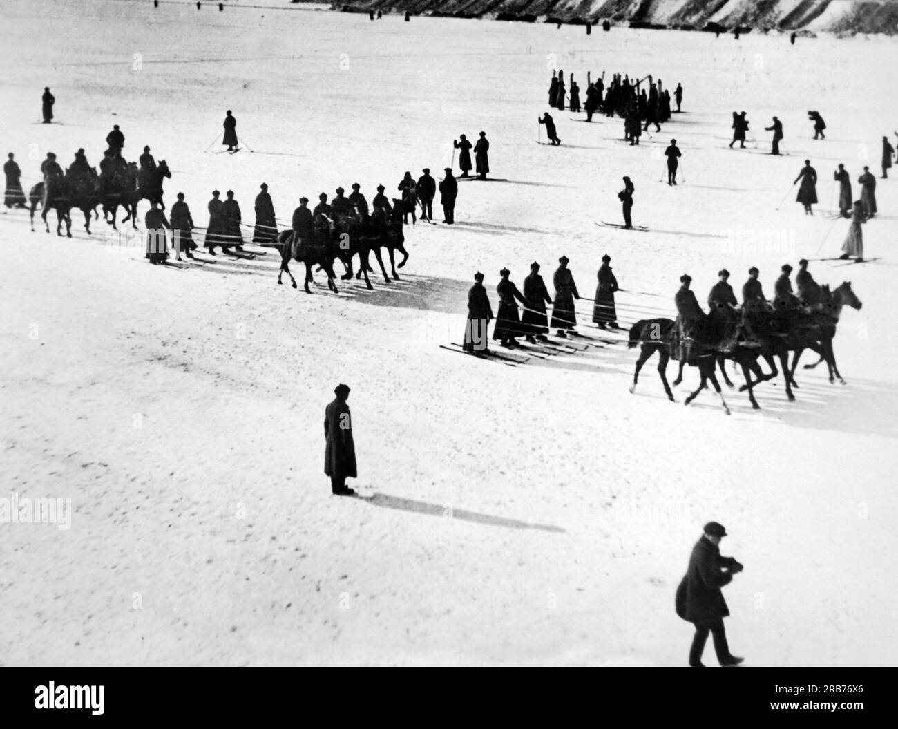 Moscow, Russia:  1930 Soviet soldiers skijoring five abreast in celebration of the 13th anniversary  of the founding of the Red Army Stock Photo