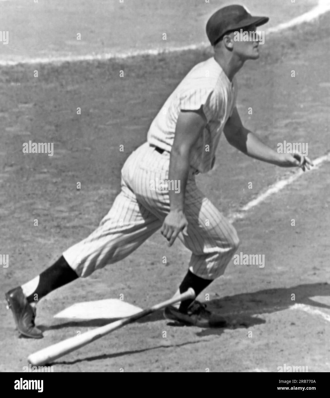 New York, New York:  August 17, 1961 New York Yankee slugger Roger Maris drops his bat and watches home run number 48 sail into the stands. He had hit number 47 earlier in the first inning. Stock Photo