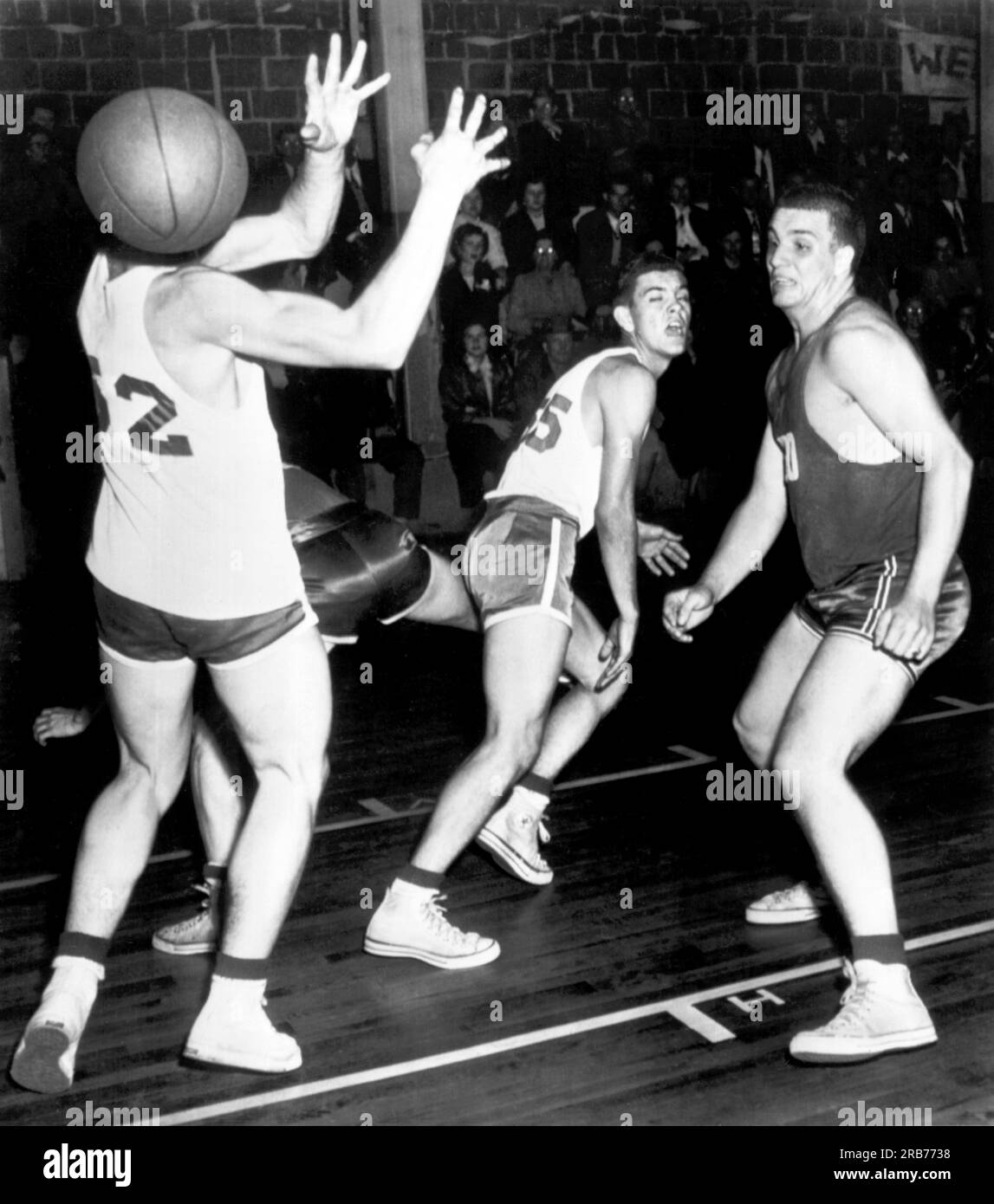 Jackson, Tennessee:  1952 A high school basketball player misses a pass and has the ball for a head. Stock Photo