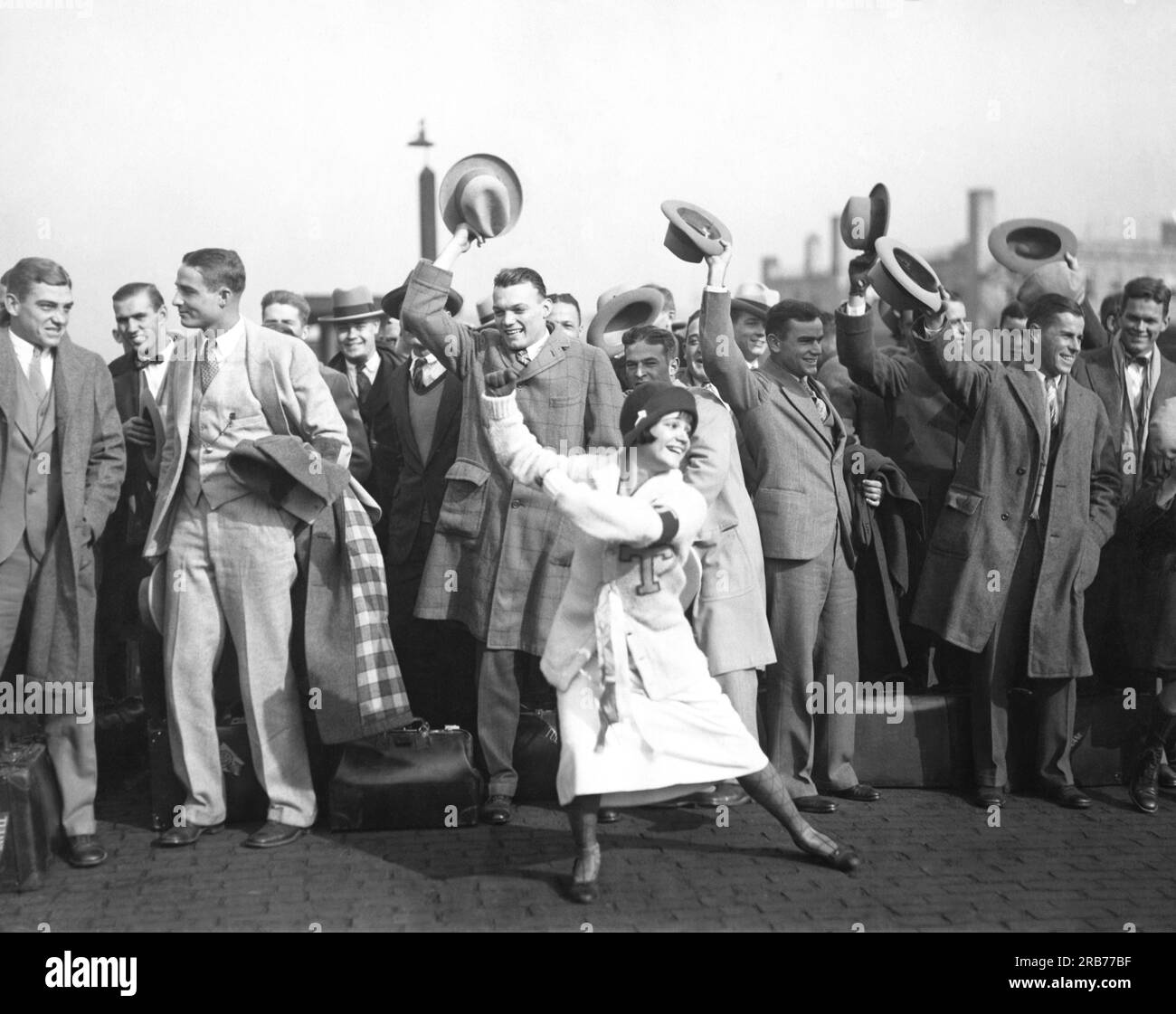 Chicago, Illinois:    October 23, 1925 The Tulane University football team along with former 'Follies Girl' cheerleader Marian Draper arrived at Chicago today to play Northwestern University at Stagg Field. Stagg was chosen for the game as it has twice the seating capacity as that at Evanston. Stock Photo