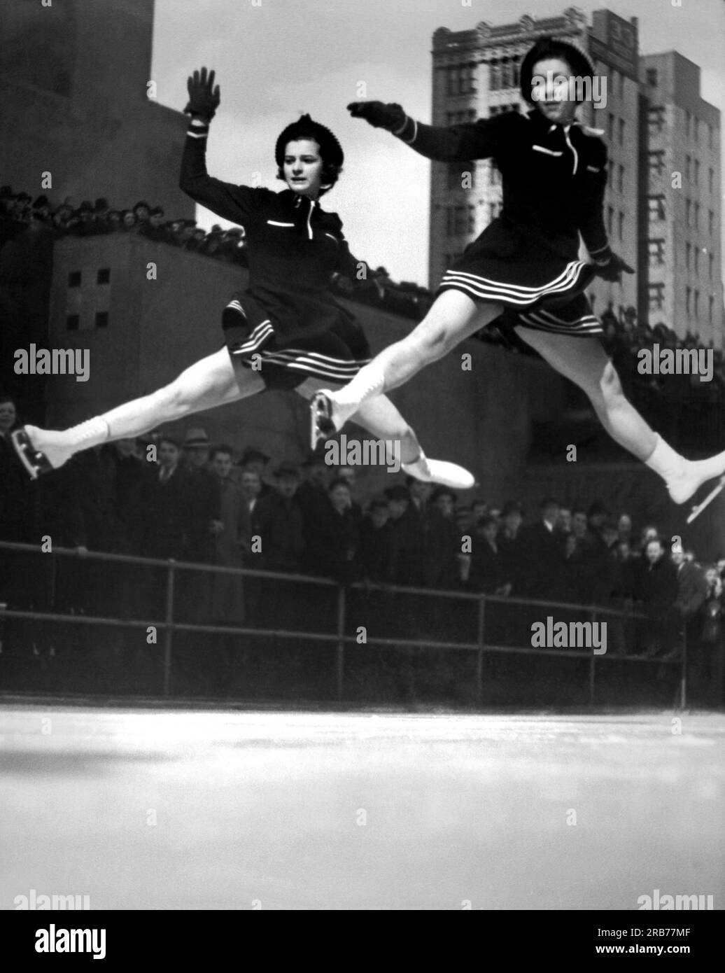 New York, New York:  1940. Two ice skaters perform on the ice at Rockefeller Center. Stock Photo