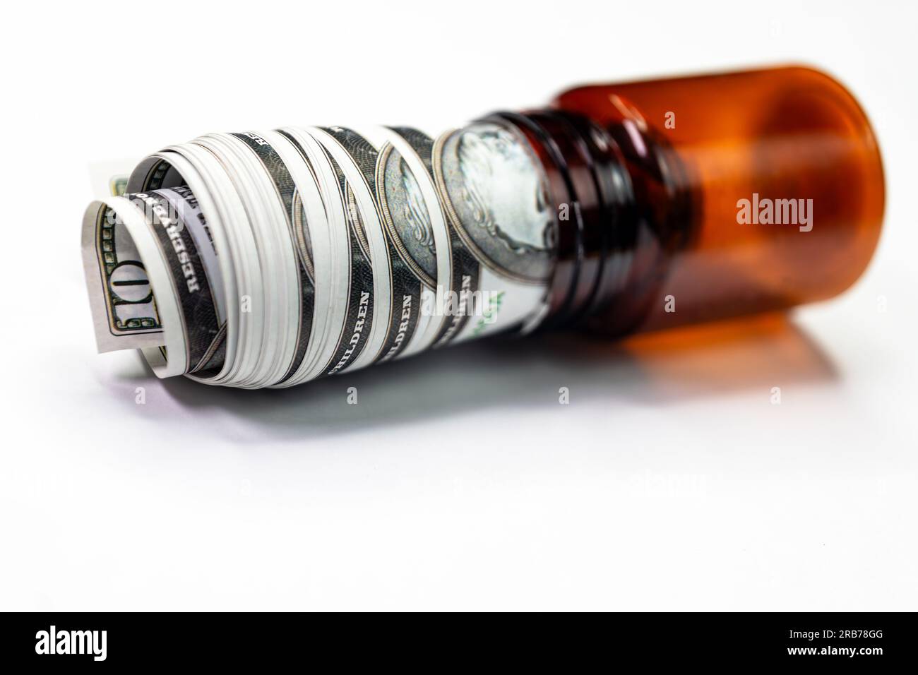 A closeup photo of a twenty dollar bill rolled up and placed inside a