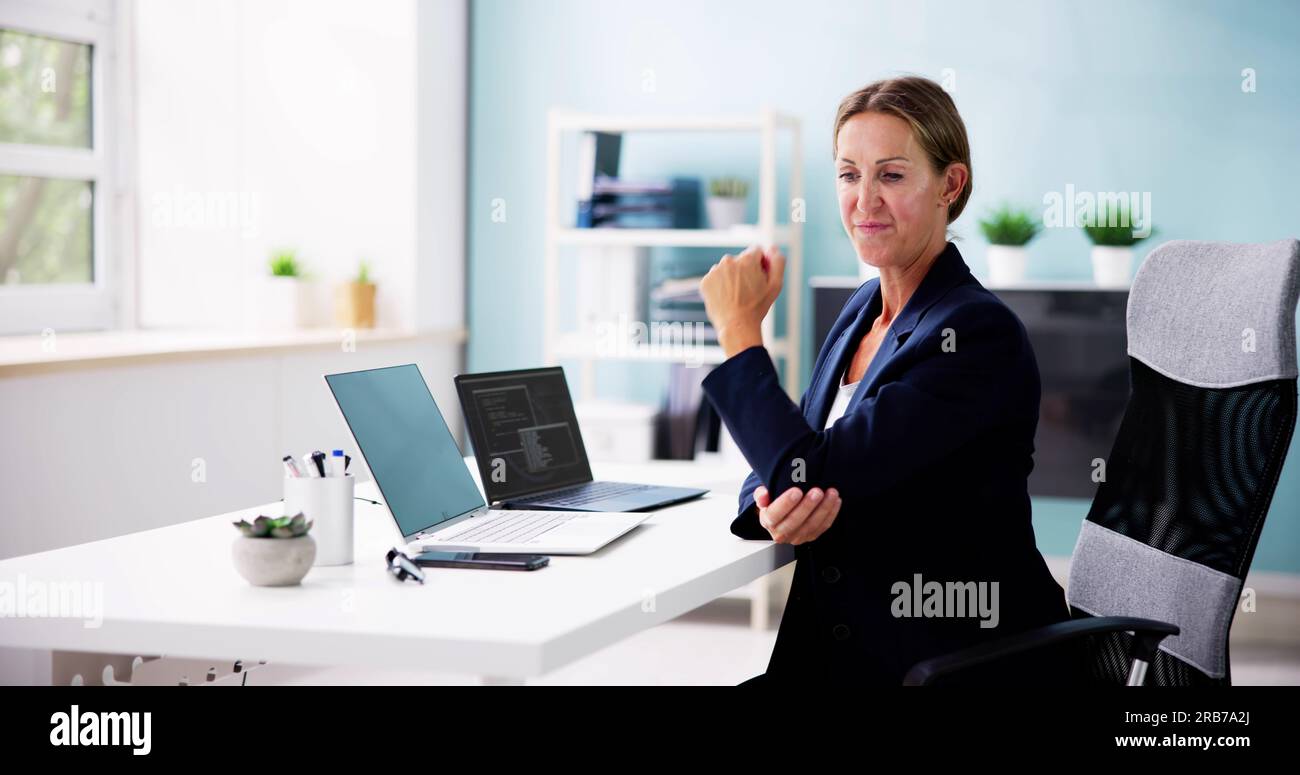 Working Women With Elbow Pain. Pinched Nerve Stock Photo Alamy