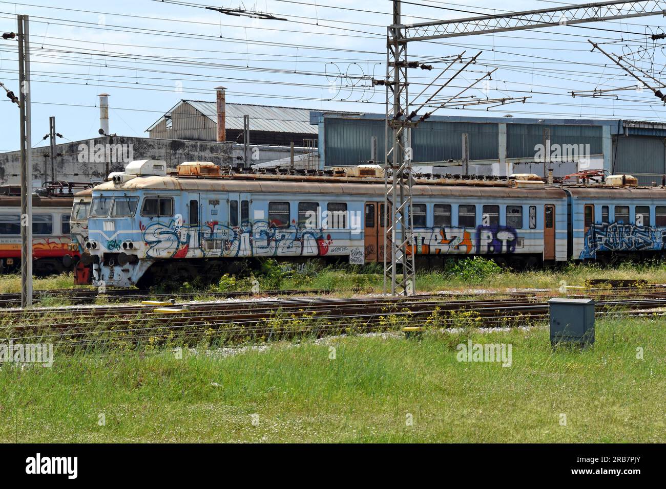Derelict and disused railway carriages in the depot at Podgorica Railway Station, Montenmegro Stock Photo