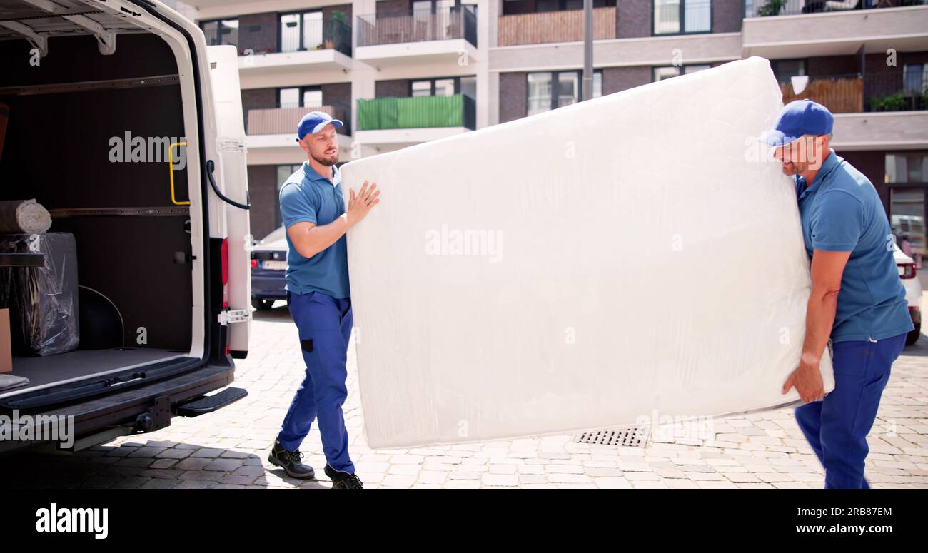 Mattress Delivery Truck. Movers Transporting And Shipping Stock Photo