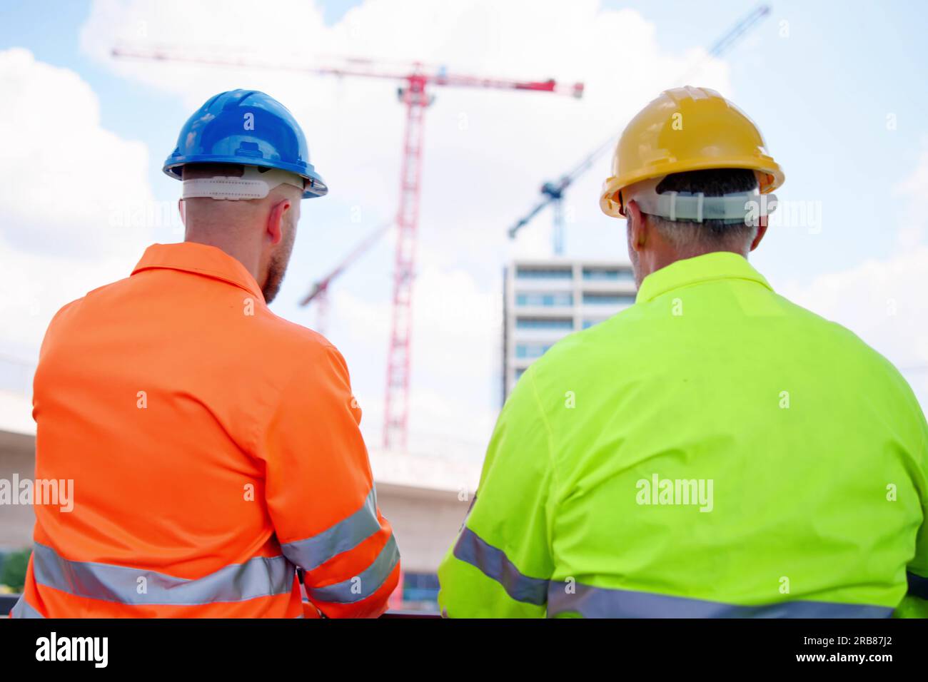 OSHA Inspector At Construction Site. Engineer Workers Stock Photo