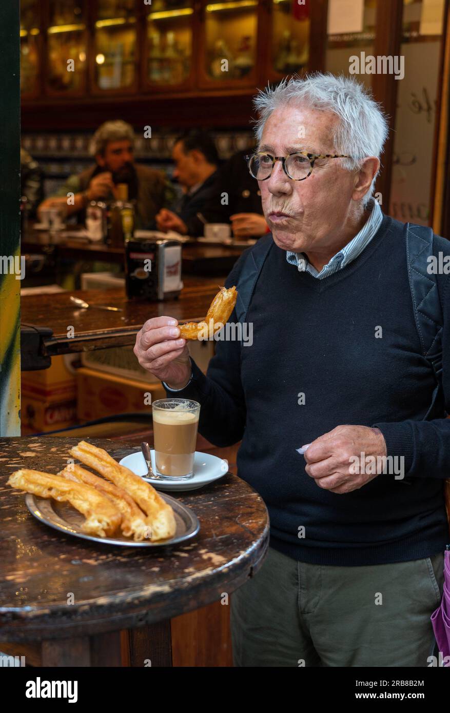 Cafe bar Bar El Comercio,Sevilla where people come and eat churros,pastries that will be dipped into hot chocolate sauce and enjoyed with coffee with Stock Photo