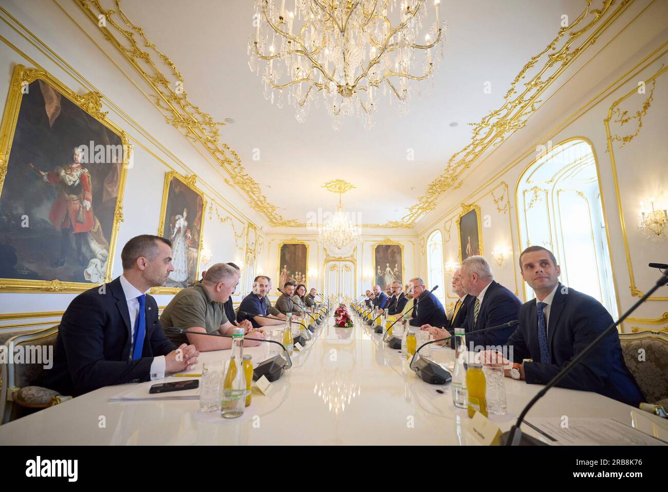 Bratislava, Slovakia. 07th July, 2023. Slovak National Council chair Borys Kollar and Slovak parliamentarians, right, before the start of an expanded bilateral meeting with Ukrainian President Volodymyr Zelenskyy, left center, and delegation at the Grassalkovich palace, July 7, 2023 in Bratislava, Slovakia. Credit: Ukraine Presidency/Ukraine Presidency/Alamy Live News Stock Photo