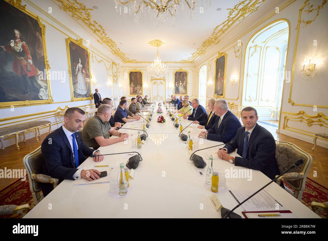 Bratislava, Slovakia. 07th July, 2023. Slovak National Council chair Borys Kollar and Slovak parliamentarians, right, before the start of an expanded bilateral meeting with Ukrainian President Volodymyr Zelenskyy, left center, and delegation at the Grassalkovich palace, July 7, 2023 in Bratislava, Slovakia. Credit: Ukraine Presidency/Ukraine Presidency/Alamy Live News Stock Photo