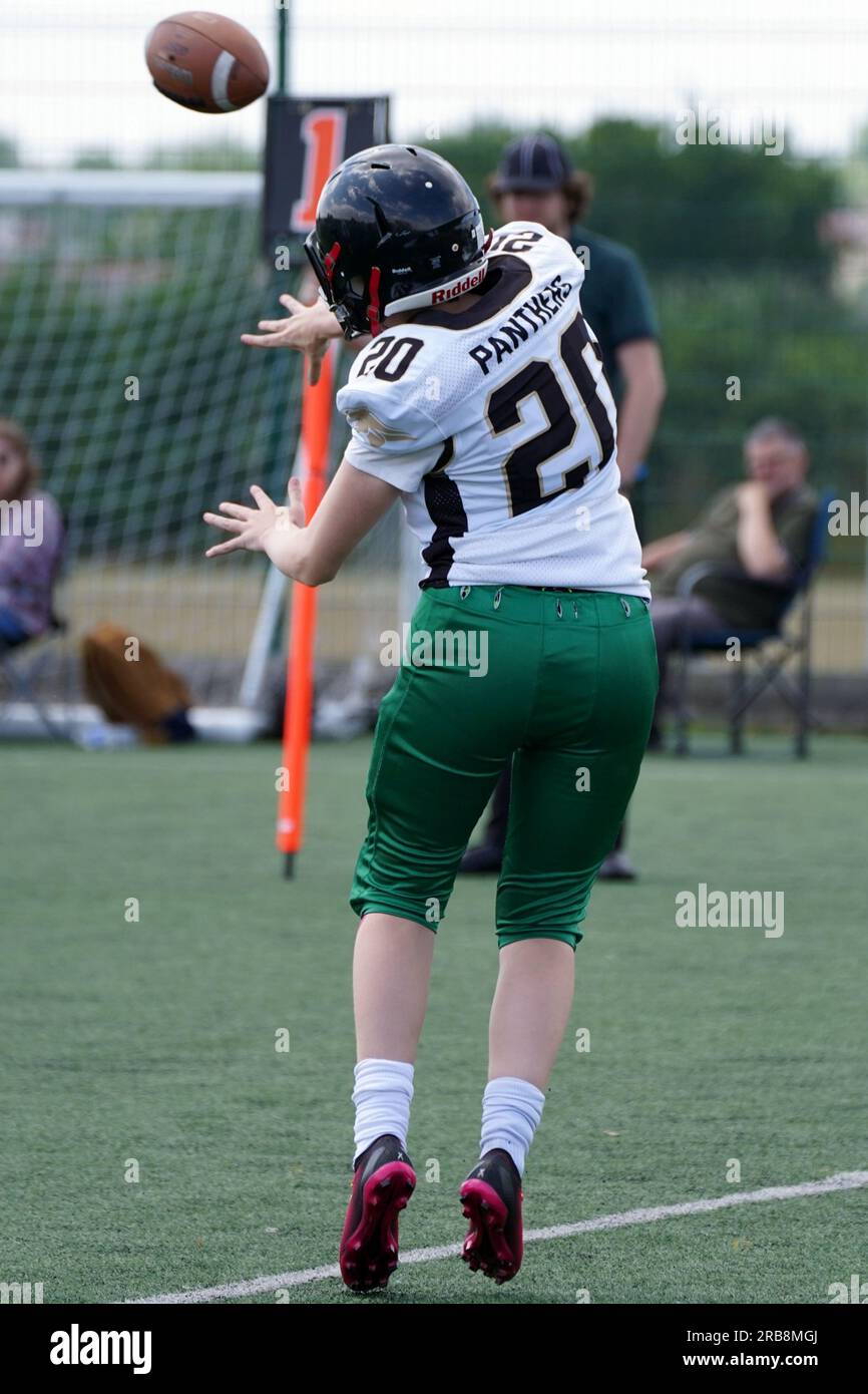 Female american football quarter back throwing the ball Stock Photo Alamy