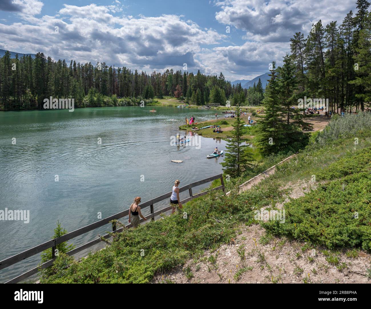 Banff National Park, Alberta, Canada – July 05, 2023:  People recreate at Johnson Lake on a hot day Stock Photo