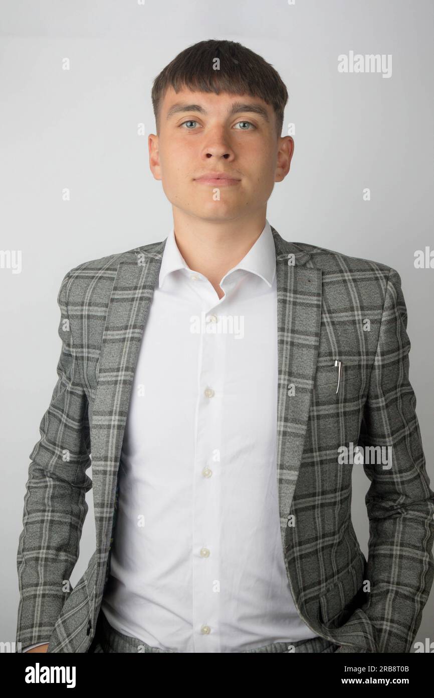 Young entrepreneur wearing a suit jacket and open neck shirt without a