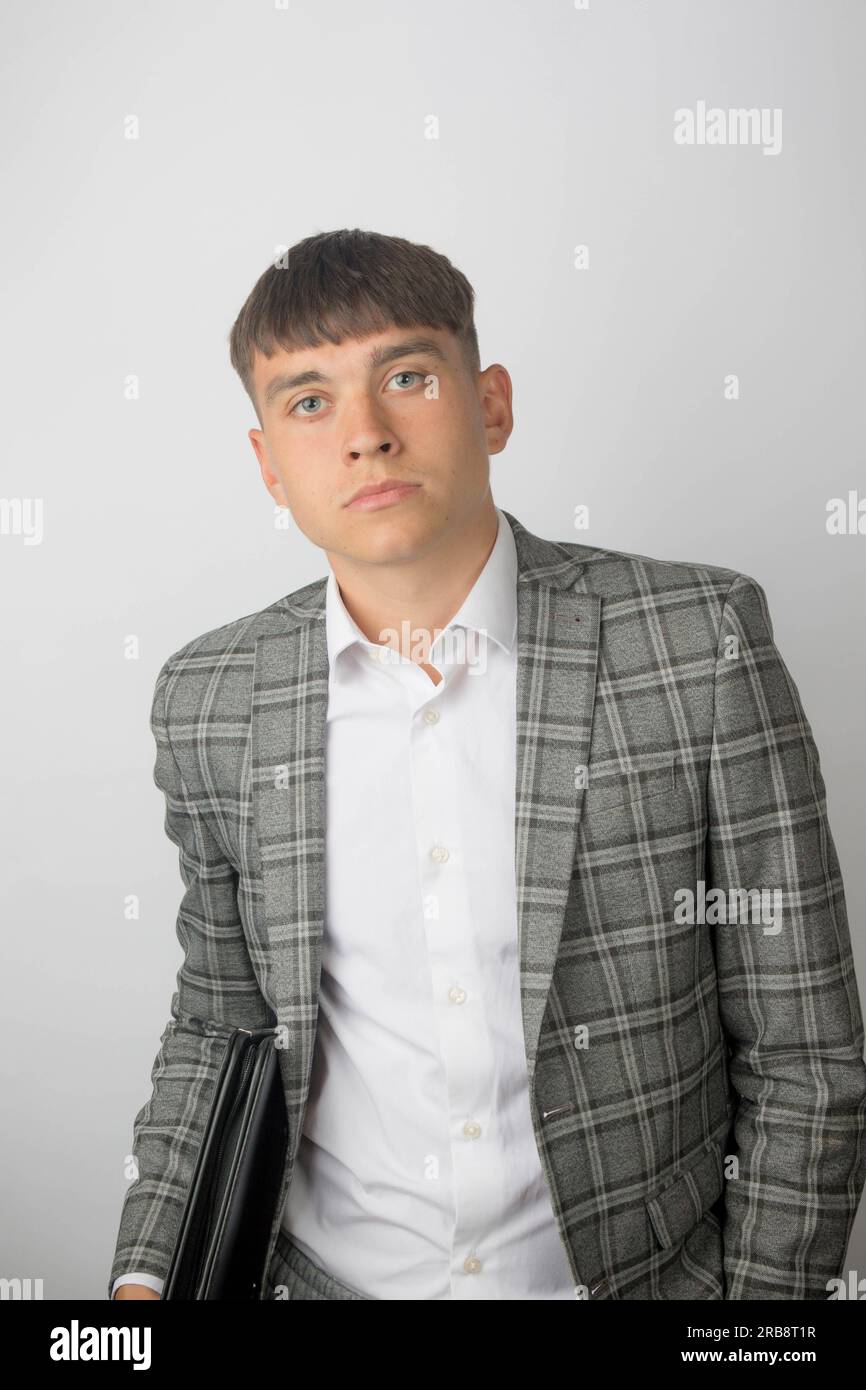 Young entrepreneur wearing a suit jacket and open neck shirt without a