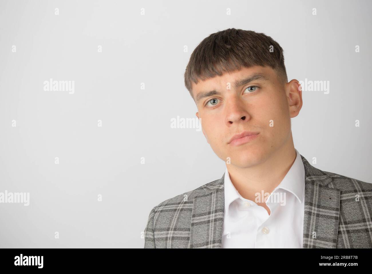 Young entrepreneur wearing a suit jacket and open neck shirt without a