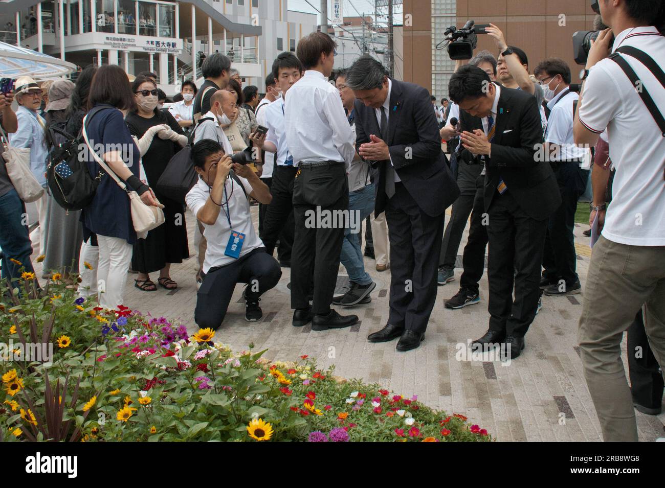 Nara, Japan. 08th July, 2023. Democratic Party for the People leader, Yuichiro Tamaki(R2) and secretary general of Democratic Party for the People, Kazuya Shinba(R3) pray during the 1st anniversary of late former President Abe's assassinated at the site where he was shot near Yamato-Saidaiji station in Nara-Prefecture, Japan on Saturday, July 8, 2023. Photo by Keizo Mori/UPI Credit: UPI/Alamy Live News Stock Photo