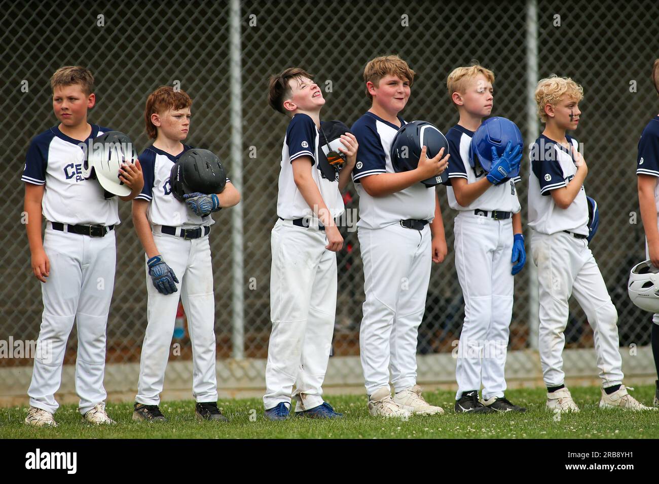 Danville, United States. 07th July, 2023. Players on the Central Columbia 9-11-year-old Division Little League baseball team stand for the National Anthem before their District 13 game against Berwick in Danville, Pa., on Friday, July 7, 2023. Central Columbia won the game 10-7. (Photo by Paul Weaver/Sipa USA) Credit: Sipa USA/Alamy Live News Stock Photo