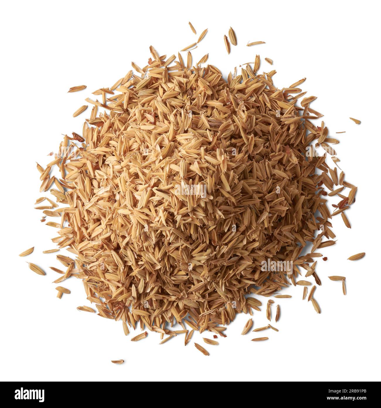 pile of paddy husk or rice husk, aka yellow rice chaff, rice husk or rice hull, outermost layer of the rice grain to use as animal feed, isolated Stock Photo