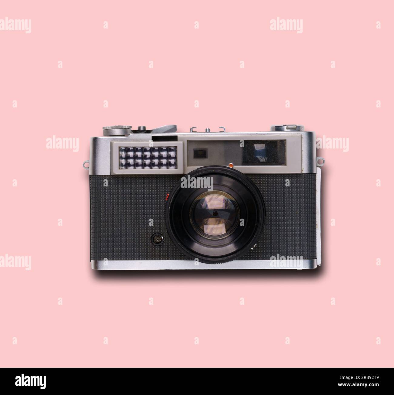 vintage old film camera on pink background with shadow Stock Photo