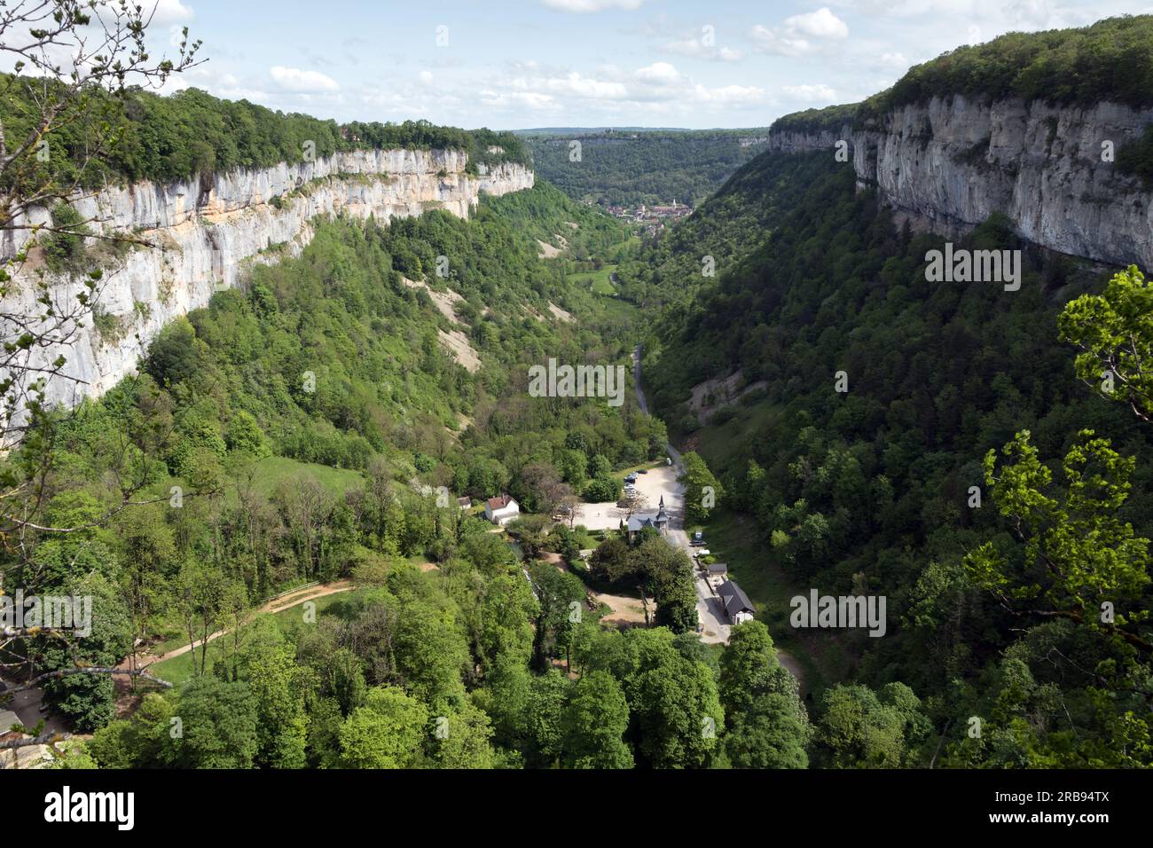 Baume-les-Messieurs and the Limestone Escarpments Surrounding the Village, Viewed from the Head of the Valley, Jura, Bourgogne-Franche-Comté, France Stock Photo