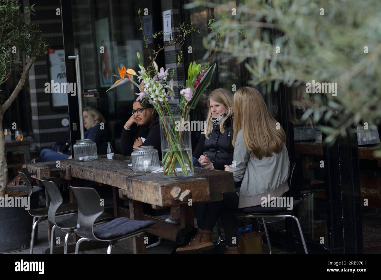 Peopel sitting in a restaurant in the city central of Frankfurt am Main, Germany Stock Photo