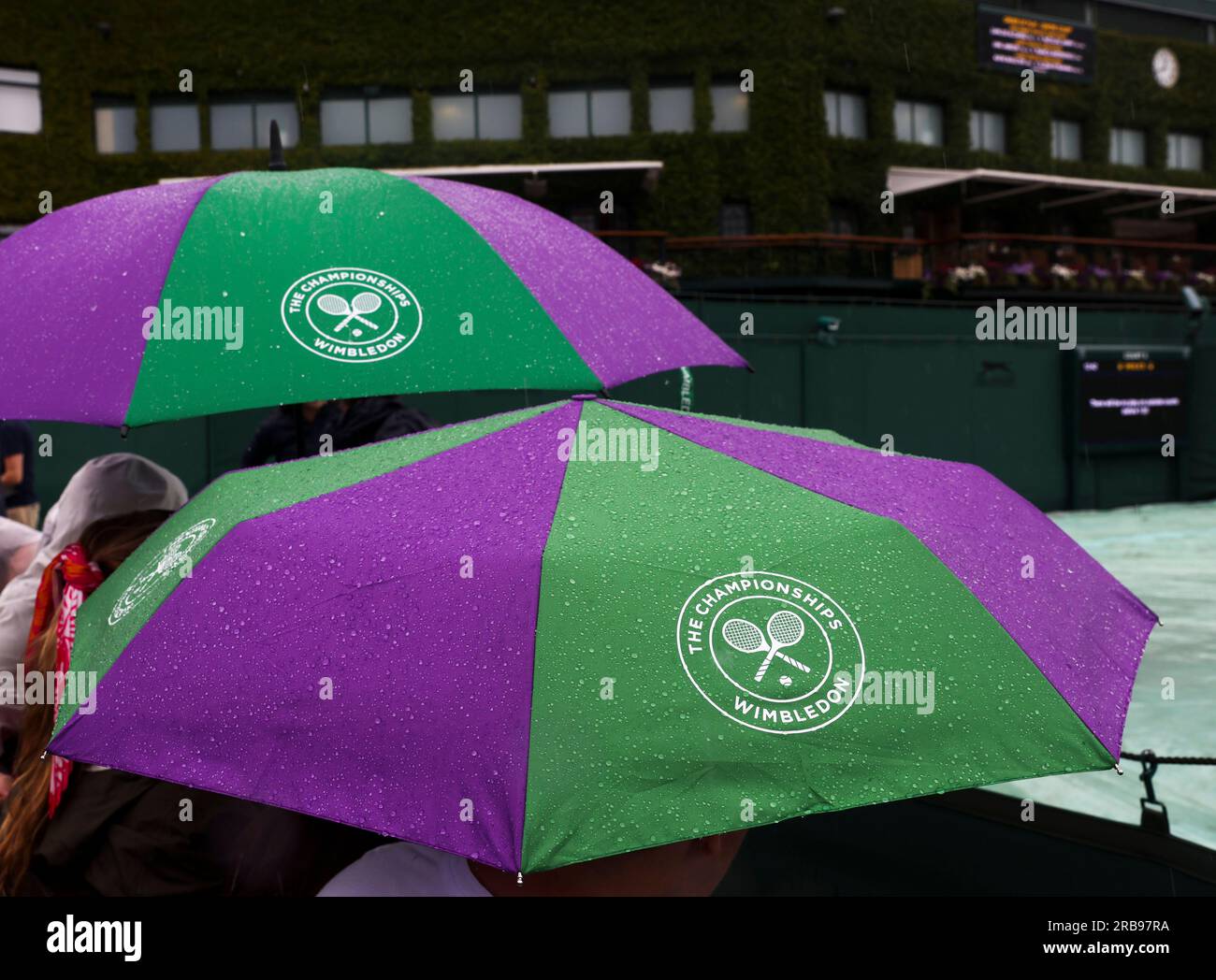 London, Britain. 8th July, 2023. People hold umbrellas in the rain at