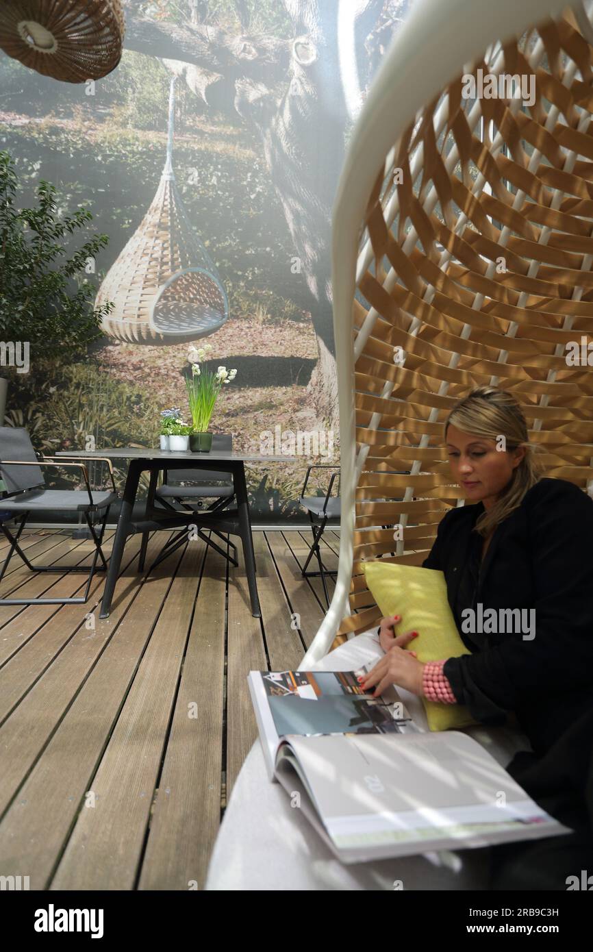 Garden hanging chair woman hi-res stock photography and images - Alamy