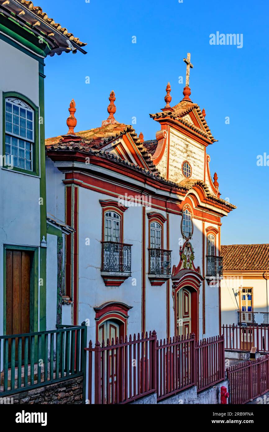 Baroque church facade and colonial houses in the city of Diamantina in Minas Gerais Stock Photo