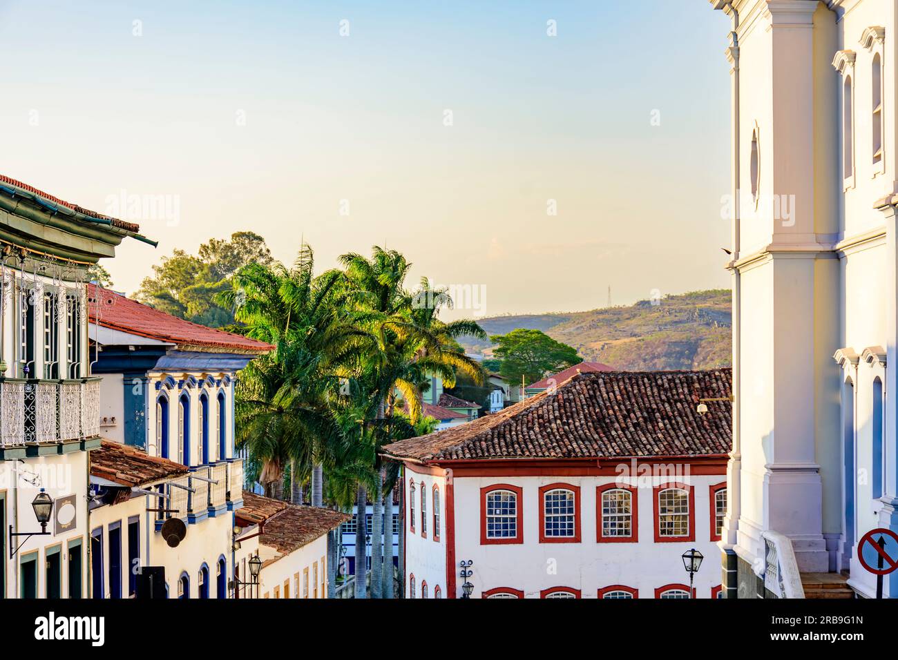 Historic center of the city of Diamantina with its colonial-style houses , hill and palm trees Stock Photo