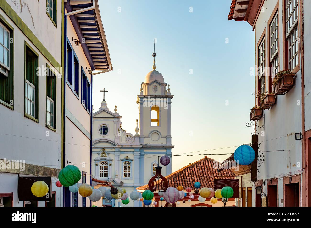 Houses and church in the streets of the city of Diamantina decorated with colorful lanterns and light fixtures Stock Photo