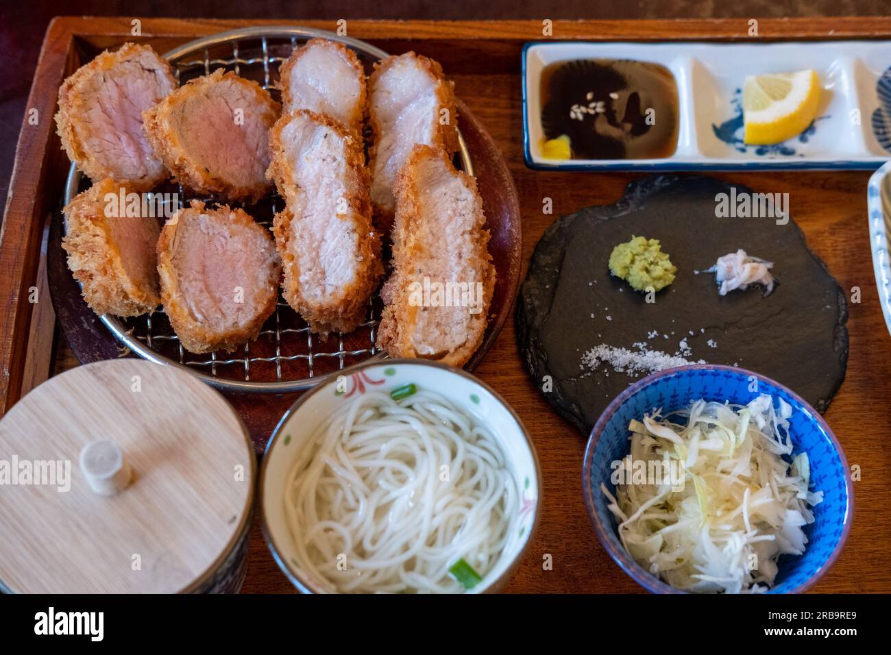 Sous Vide tonkatsu, Fried Pork with side dishes serve on plate in restaurant Stock Photo Alamy