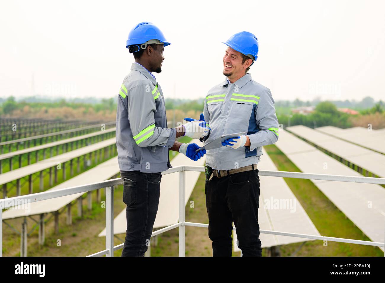 Solar energy engineer maintaining panels hi-res stock photography and ...