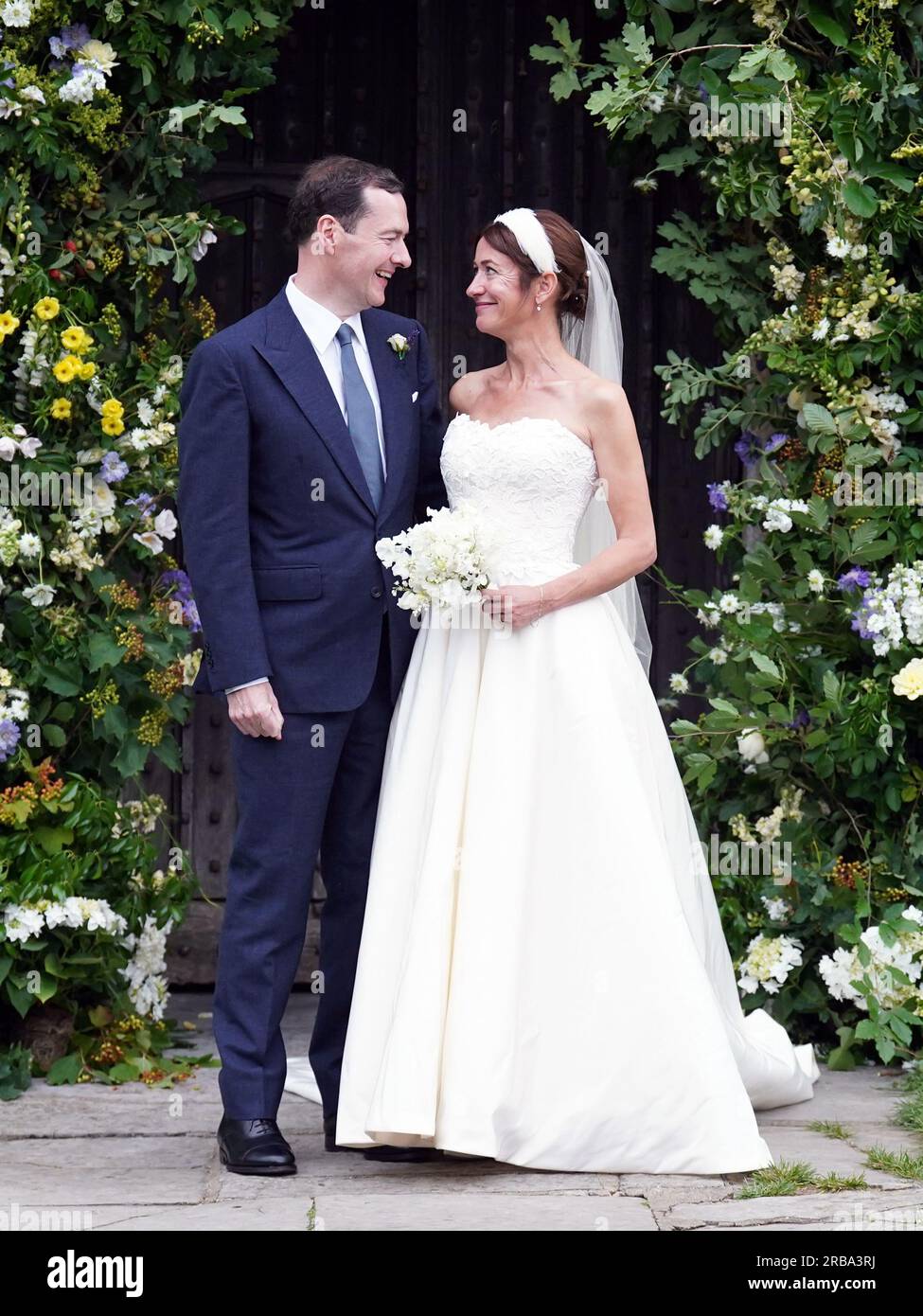 Former chancellor George Osborne with his wife and former adviser, Thea Rogers, outside St Mary's Church in Brunton, Somerset, following their marriage. Picture date: Saturday July 8, 2023. Stock Photo