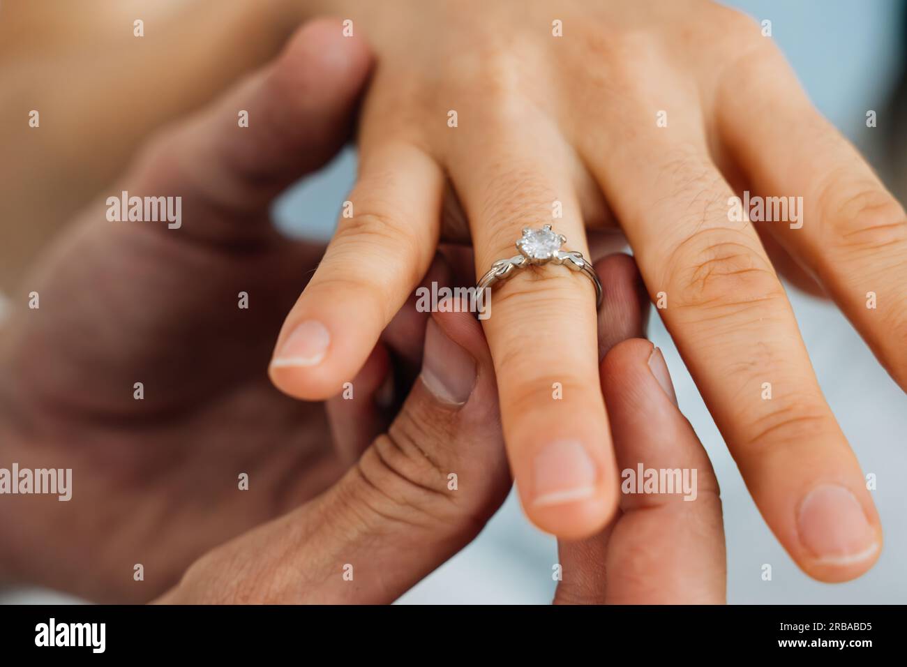 Purposing Rings Romantic couple making love promise with ring to each other at home ...