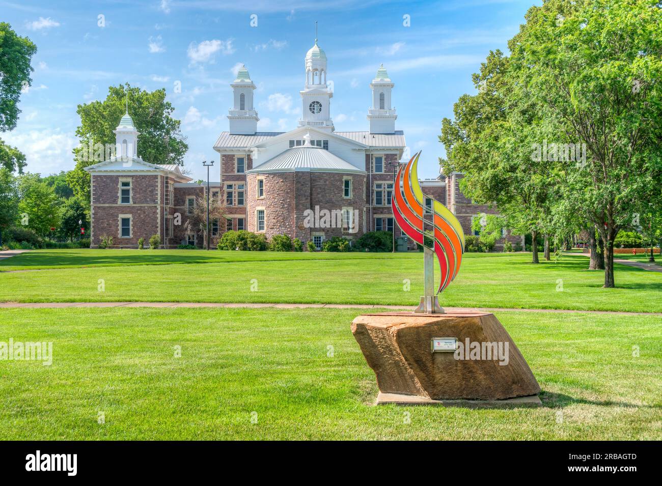 VERMILLION, SD, USA JUNE 22, 2023 Spectrum Sculpture and Old Main on