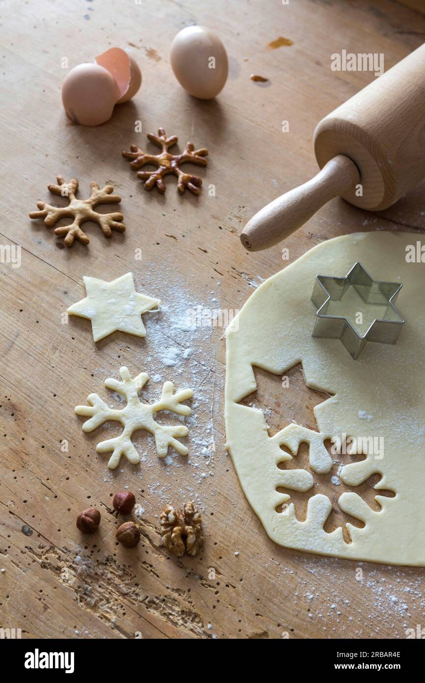 Christmas bakery, short pastry is rolled out on a baking board, cookie