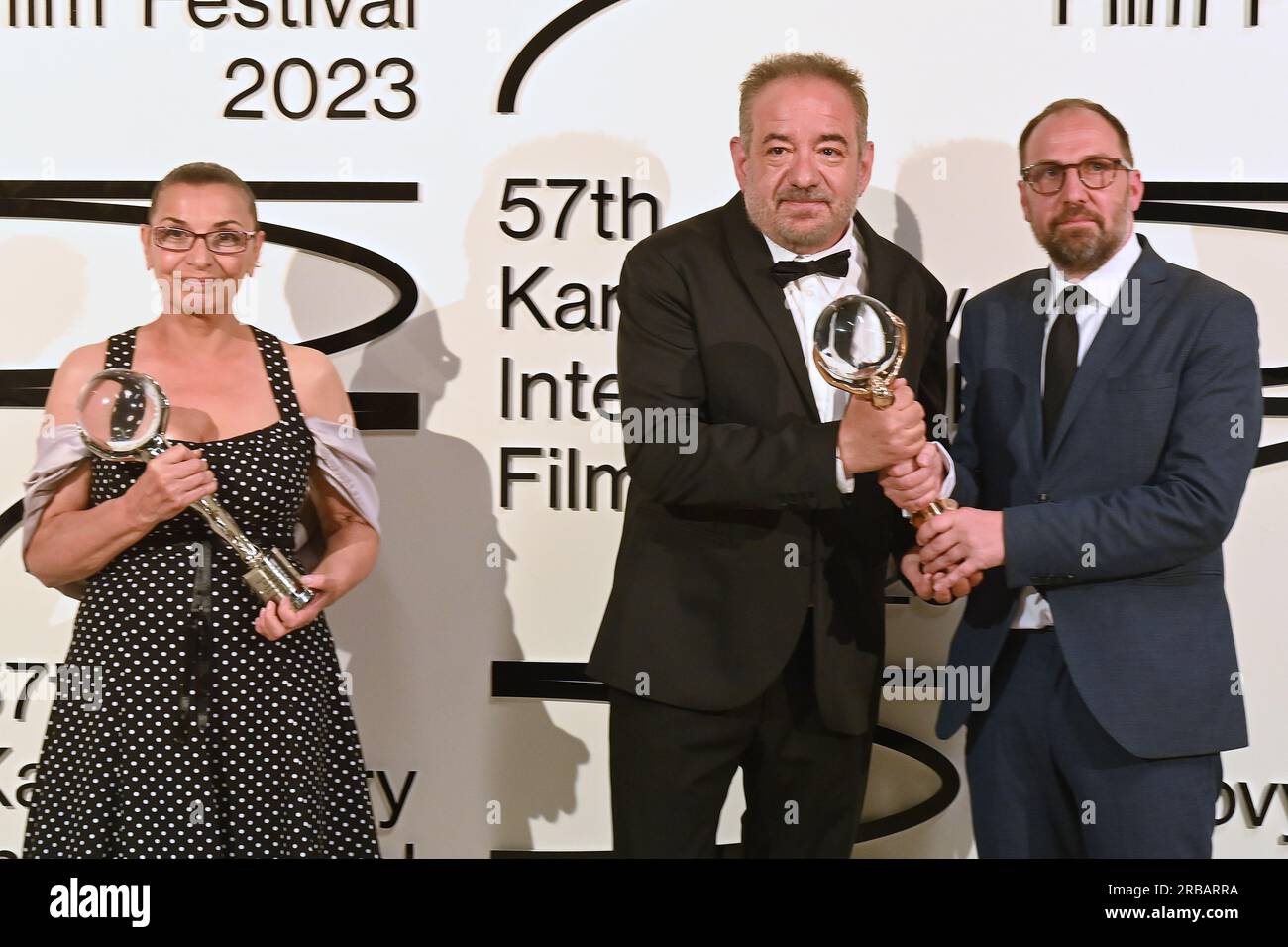 Karlovy Vary, Czech Republic. 08th July, 2023. The last day of the 57th Karlovy Vary International Film Festival, 8 July 2023. Bulgarian actress Eli Skorcheva receives the award for Best Actress for her role in the film Blaziny lekce at the closing ceremony. From left: actress Eli Skorcheva and director Stephan Komandarev. Credit: Slavomir Kubes/CTK Photo/Alamy Live News Stock Photo