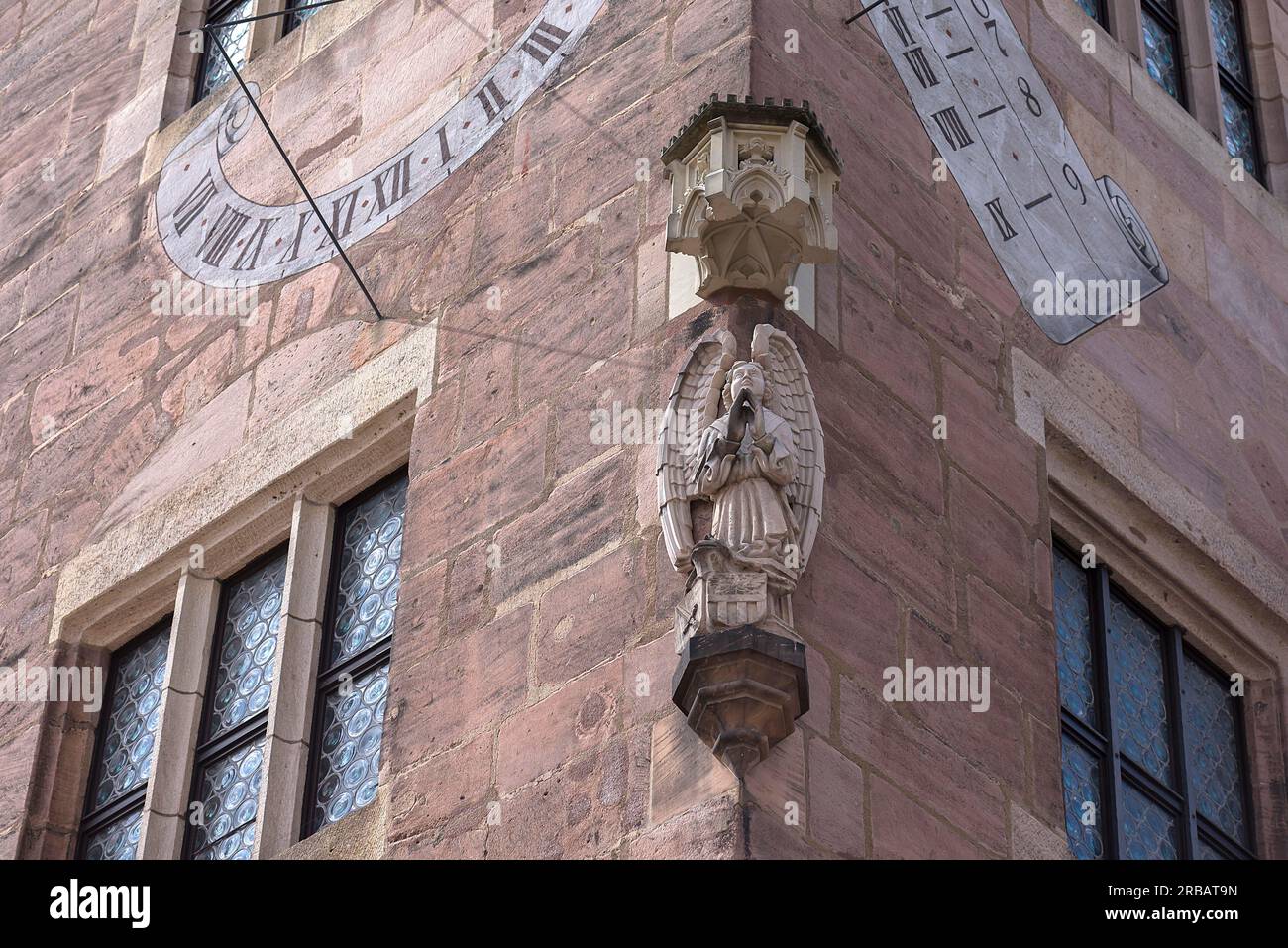 Nassauer Haus, historic residential tower with sundial and angel sculpture, Karolinenstr. 2, Nuremberg, Middle Franconia, Bavaria, Germany Stock Photo