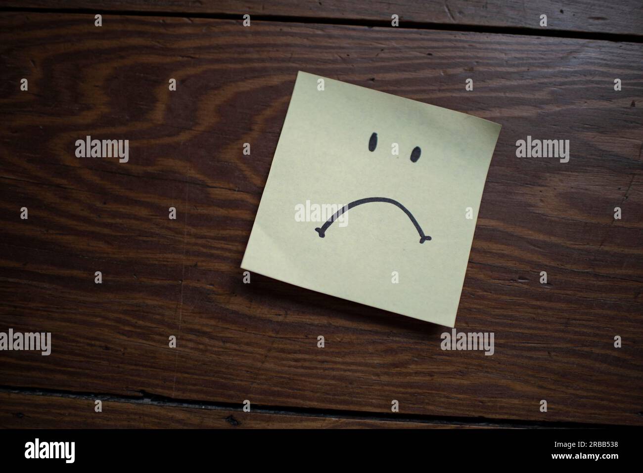 Note with bad-tempered smiley Stock Photo