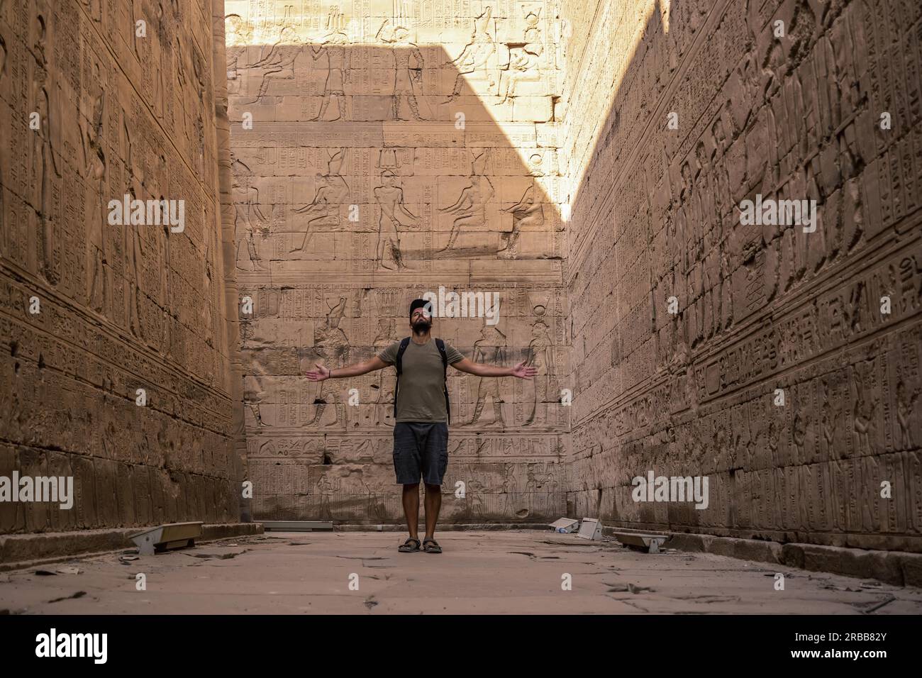 Visiting Edfu A young tourist visiting the beautiful temple of Edfu in the city of ...