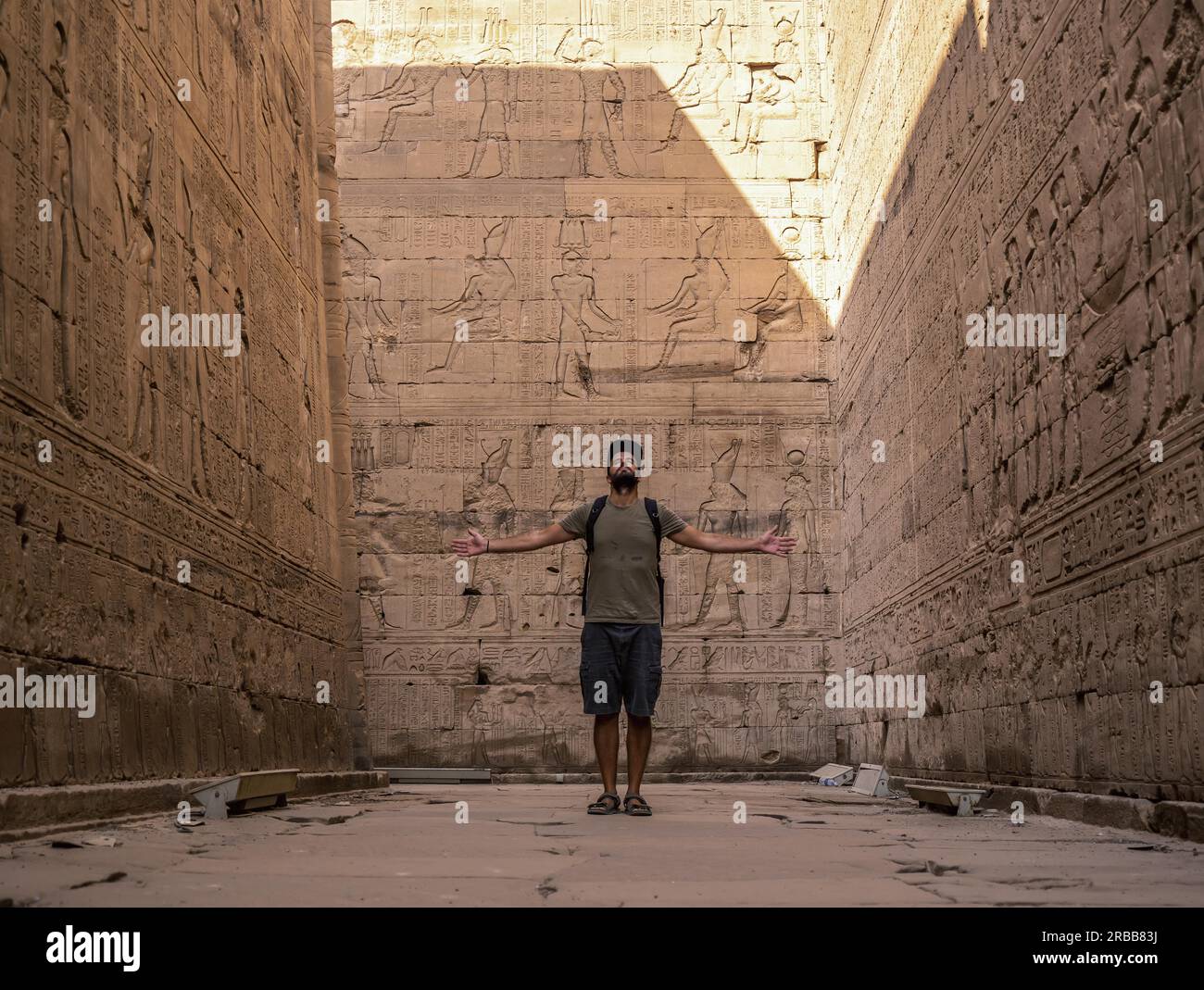 Visiting Edfu A young tourist visiting the beautiful temple of Edfu in the city of ...