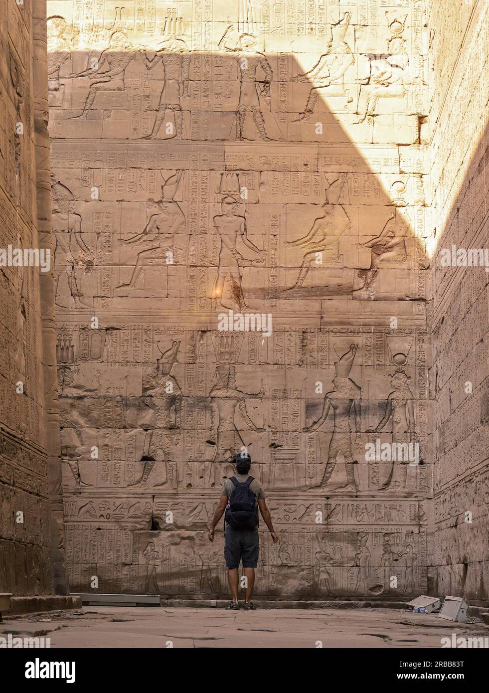 Visiting Edfu A young tourist visiting the beautiful temple of Edfu in the city of ...