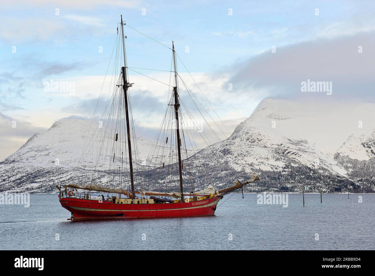 Two-master Noorderlicht sailing out of Skarberget, Lofoten, Norway Stock Photo