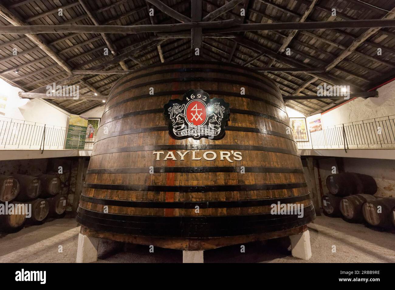 Huge oak barrel with port wine, historic cellar of Taylor's port winery