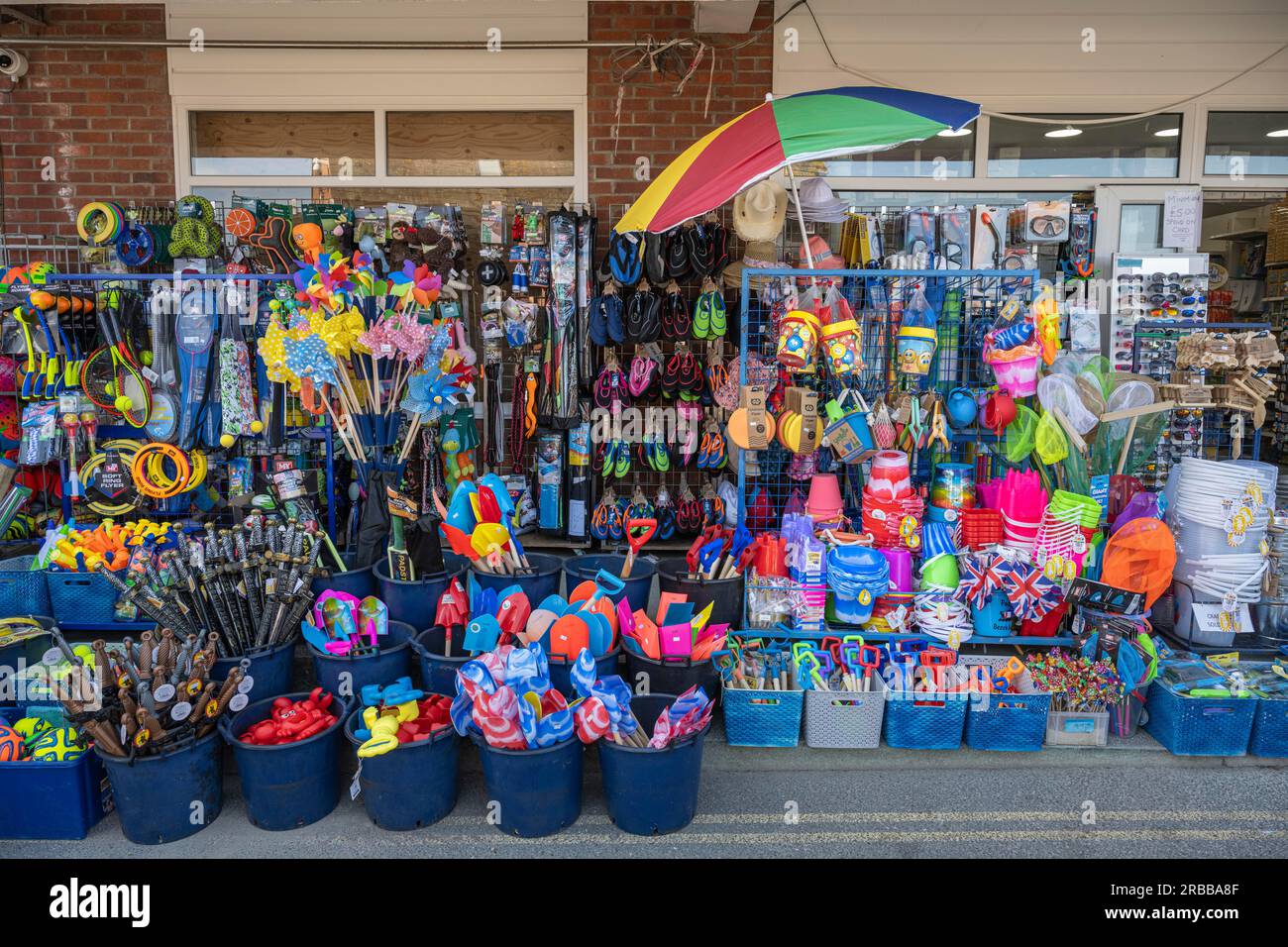Plastic beach toys outside a shop, Padstow, North Cornwall, England, United Kingdom Stock Photo