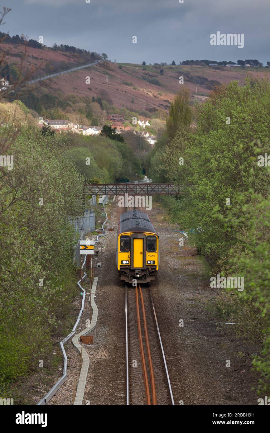 Transport For Wales class 150 sprinter train passing Ton Pentre on the single track Rhondda valley railway line in the south Wales valleys Stock Photo