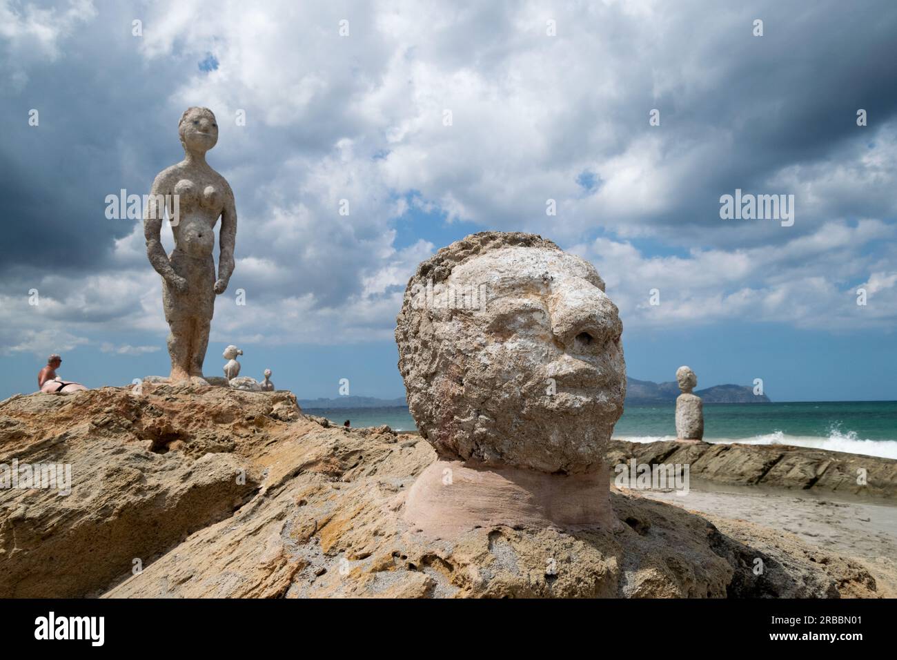 Big stone head sculpture from Son Bauló beach at Palma de Mallorca Spanish island. Mystical stone sculptures with Human forms. Stock Photo