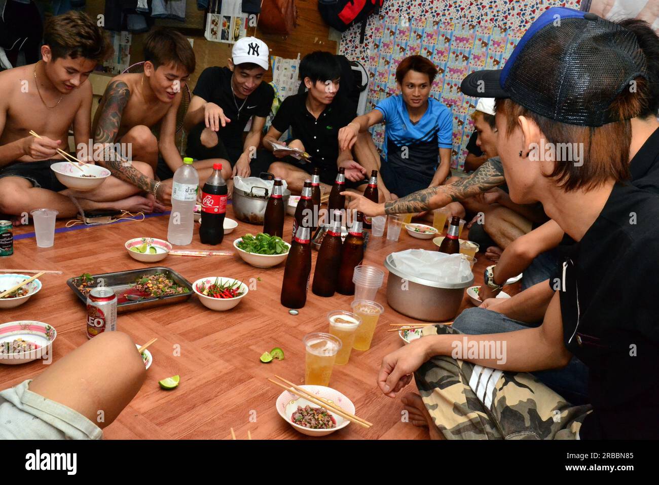 Young Vietnamese men have a simple funeral wake meal together in memory