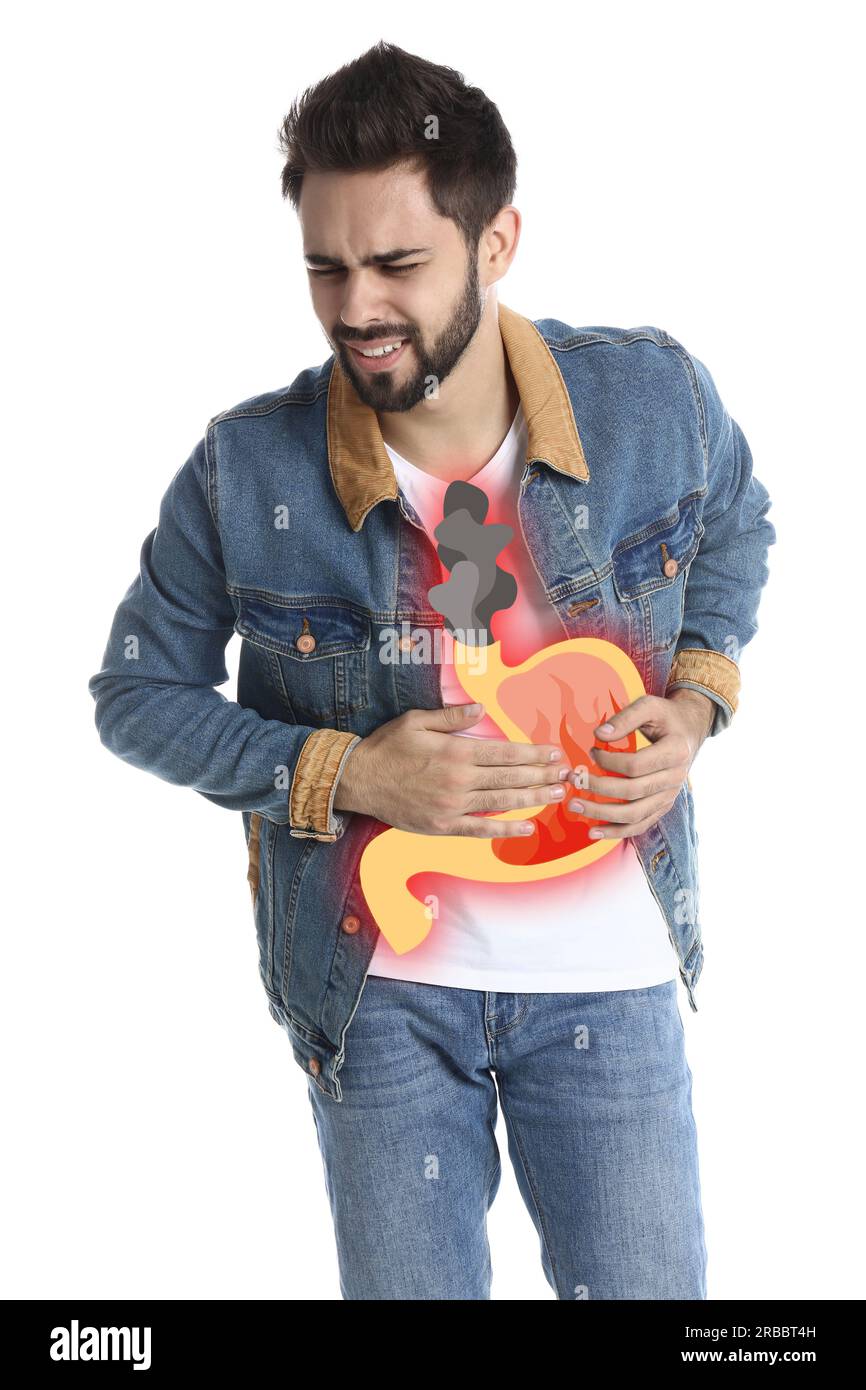 Man suffering from heartburn on white background. Stomach with fire and