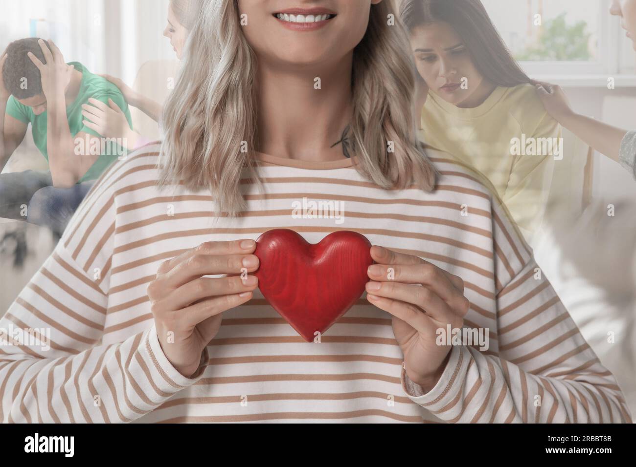 Smiling woman holding red wooden heart as symbol of empathy, closeup. Situations showing need for emotional support on background, double exposure Stock Photo